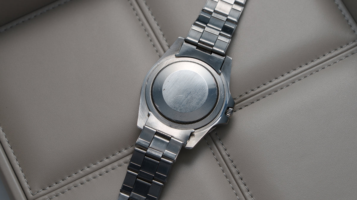 1675, GMT-Master, Fuchsia Bezel, Steel